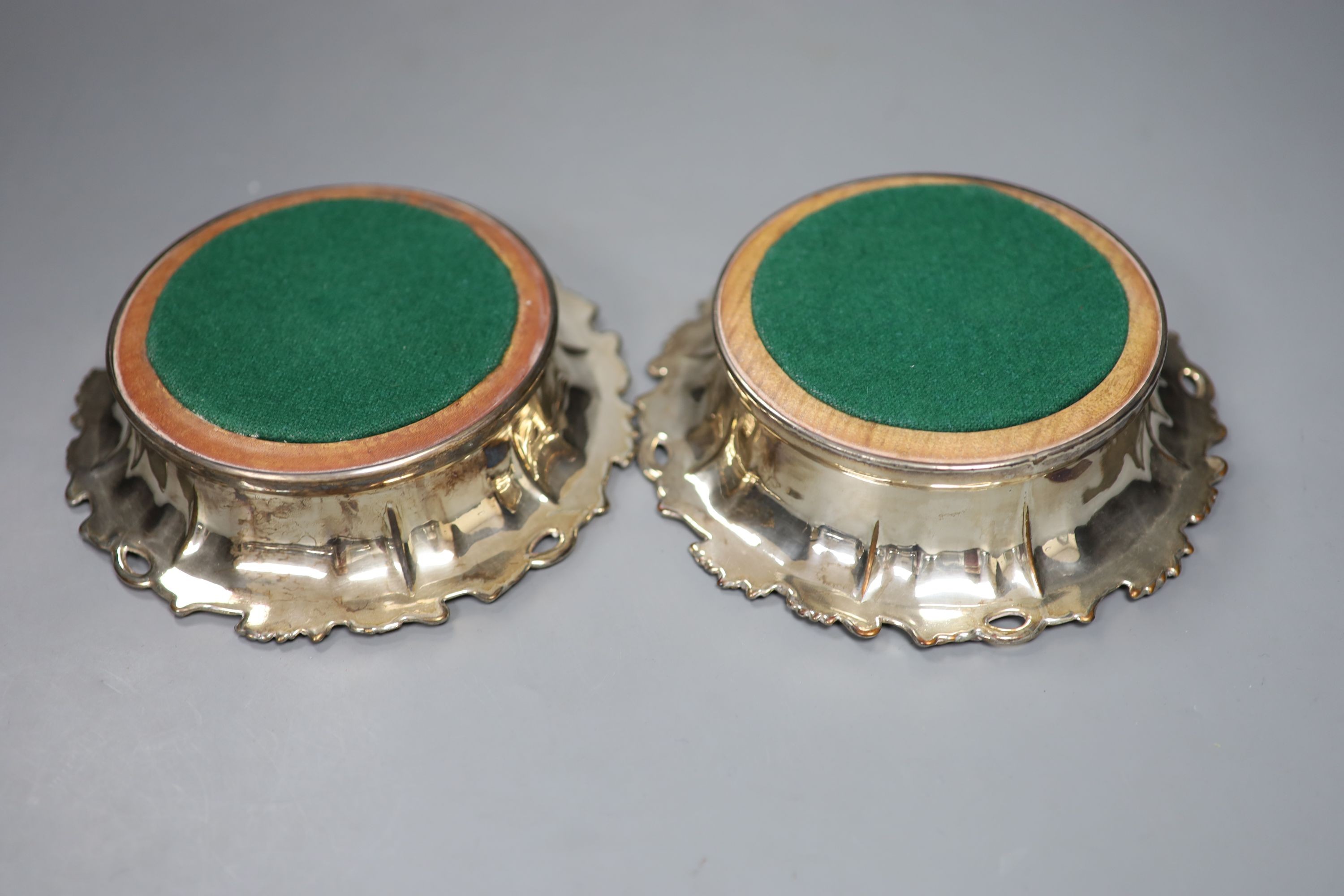 A pair of 19th century plated wine coasters. 17cm